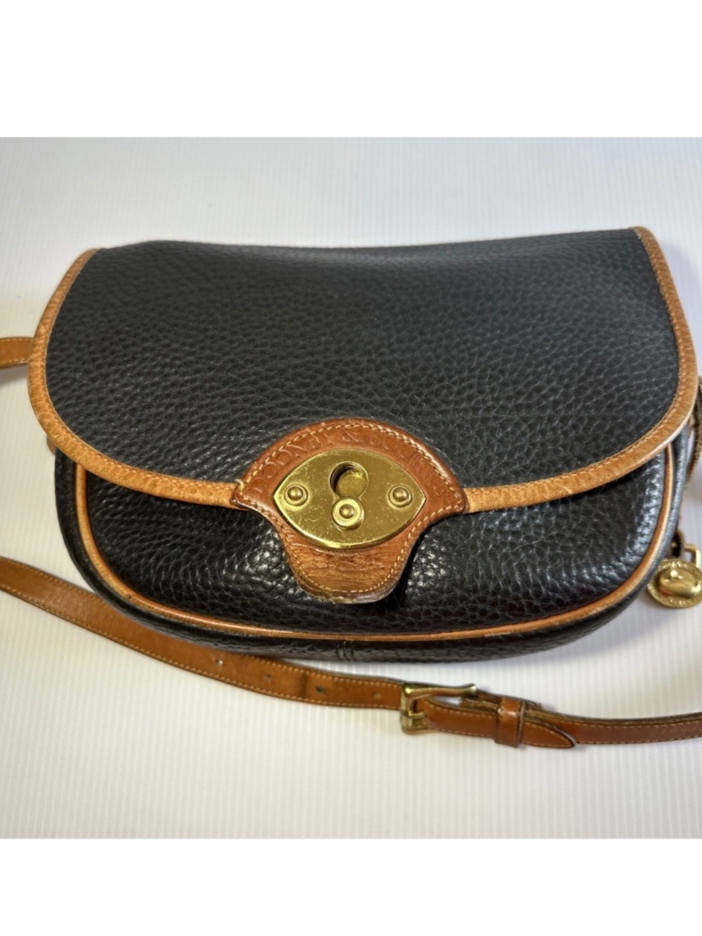 Authentic vintage Dooney Bourke Vintage Cavalry Trooper AW Leather Saddle bag